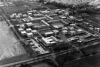 The method of building using prefabricated panels is clearly shown in this photograph of the construction of one of the Montgomery Lines accommodation blocks.