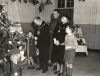 The Mayor and Mayoress of Aldershot, Councillor and Mrs Stroud, admire the Christmas tree with a couple of children at the No. 1 Canadian General Reinforcement Unit Christmas Party in 1943. Behind is RSM Jewkes of St Johns, Quebec. (Courtesy of the Aldershot Military Museum)